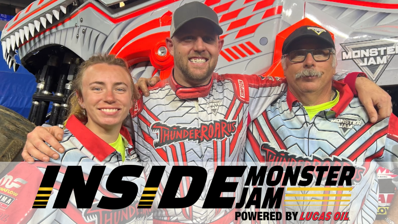 Photo of Shelby Fisher with Colt Stephens in front of ThunderROARus with "Inside Monster Jam Presented by Lucas Oil" graphic