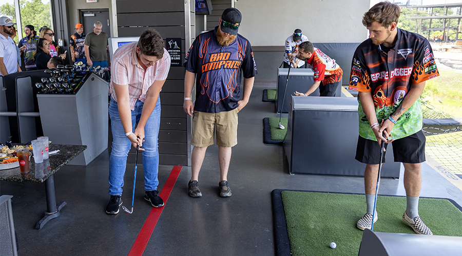 Monster Jam drivers playing Topgolf