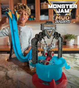 Child playing with Monster Jam toy with caption Monster Jam Mud Blasters