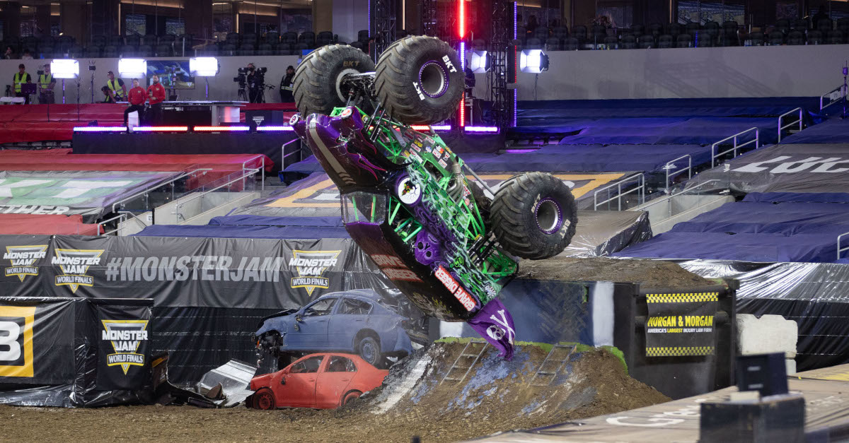 Tyler Menninga doing a backflip at Monster Jam World Finals in Grave Digger Purple